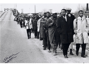 Hosea Williams of SCLC, left, and John Lewis of Student nonviolent Coordinating Connitte leading more than 500 people across Edmund Pettus Bridge (Selma) on March 7, 1965